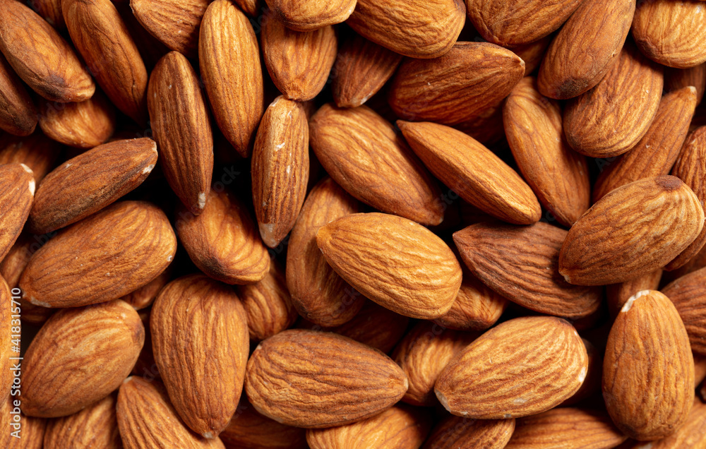 Close up of almond nuts as background. Close up of almond nuts as background.