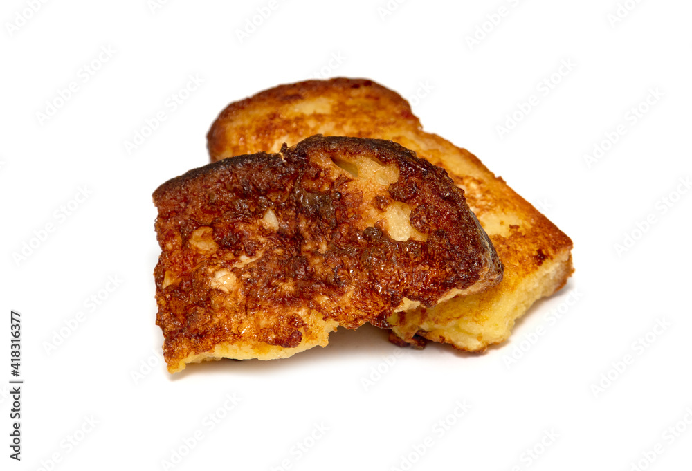 bread soaked in egg croutons on a white plate, fried bread soaked in egg croutons on a white plate, fried