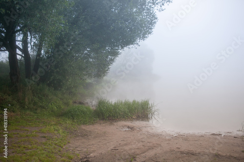fog in the morning forest on the lake, mystical landscape, summer, green, nature of Russia, Volga river, water