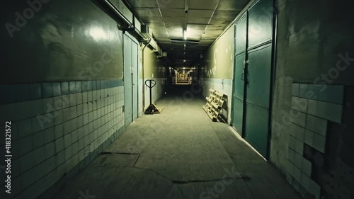Stack of footage: Walking through Old dark apartment building, long dark hallway.