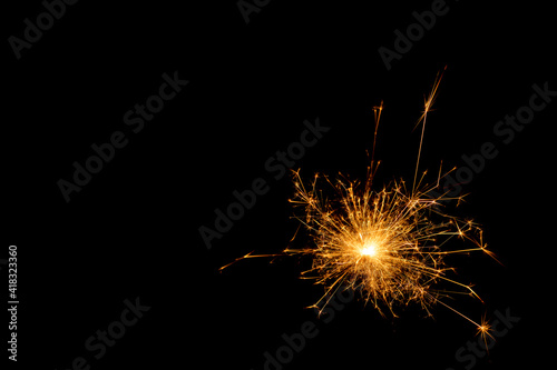 A picture of a real sparkler set against a black background