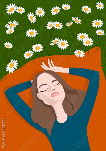 Girl lying on green grass with camomiles. Person enjoying beautiful nature. Summer time.