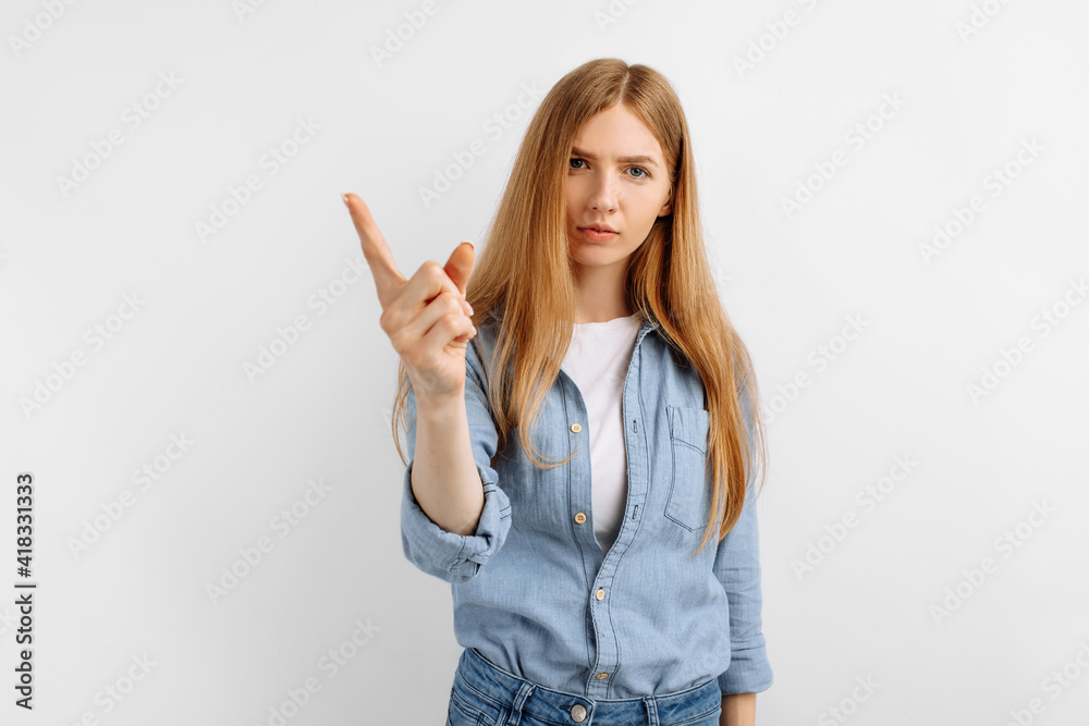 Serious young woman warning and looking at camera, on white background Serious young woman warning and looking at camera, on white background