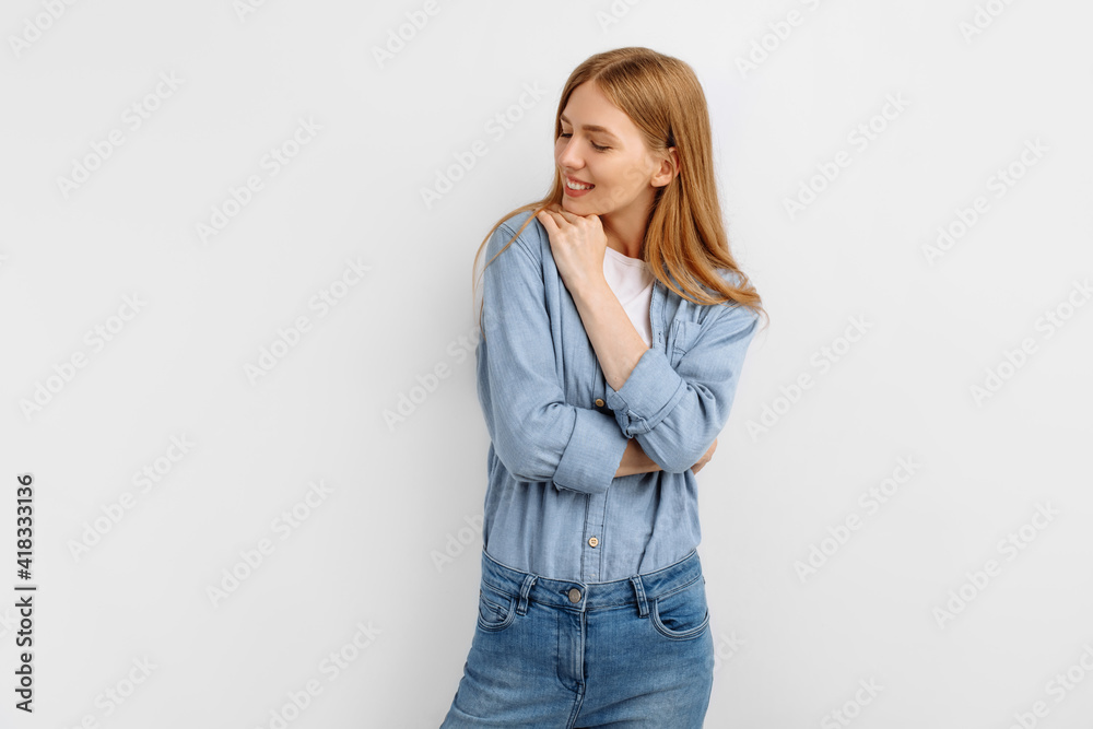 woman, in casual clothes, smiling while looking at camera, on white background woman, in casual clothes, smiling while looking at camera, on white background