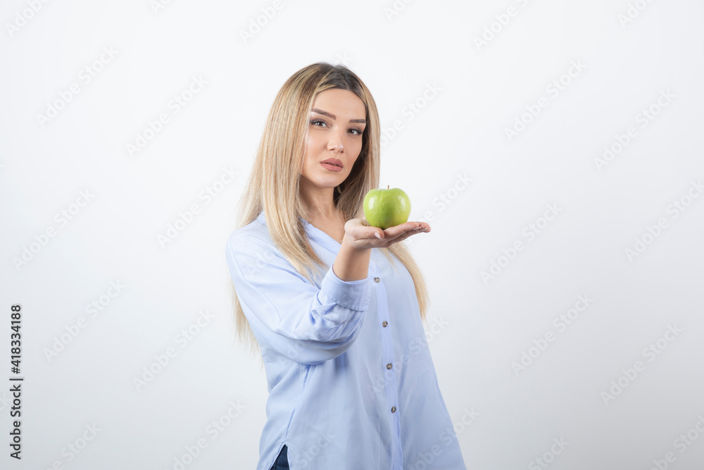 Portrait photo of a pretty attractive woman model standing and holding Portrait photo of a pretty attractive woman model standing and holding