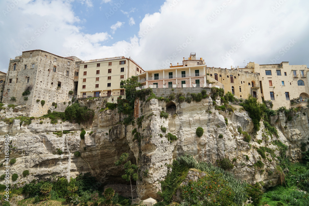 Historical coastal harbour town Tropea with houses located on steep cliffs, popular holiday touristic place in Calabria, Italy
