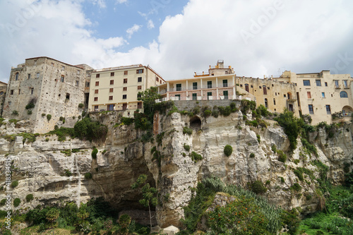 Historical coastal harbour town Tropea with houses located on steep cliffs, popular holiday touristic place in Calabria, Italy