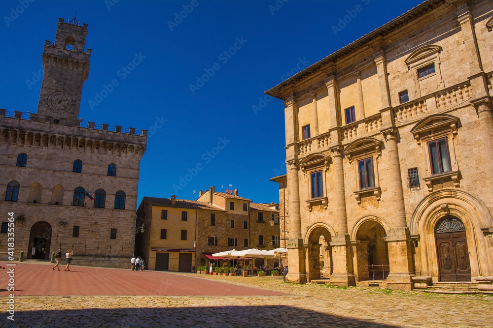 The main square in Montepulciano in Siena Province, Tuscany, Piazza Grande. Palazzo Nobili-Tarugi palace on the right and Palazzo Comunale town hall on the left
