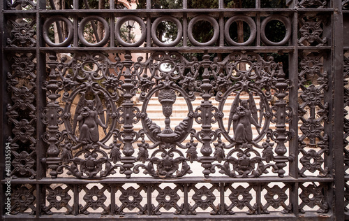 old metal gate with ornament to the cathedral of malaga, spain