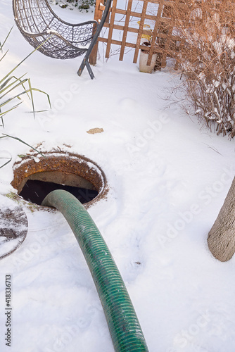 pumping septic tanks from the backyard tank in the countryside