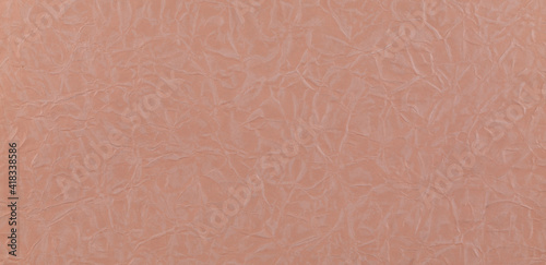 Texture of orange crumpled paper, abstract background, wallpaper, copy space for text.
