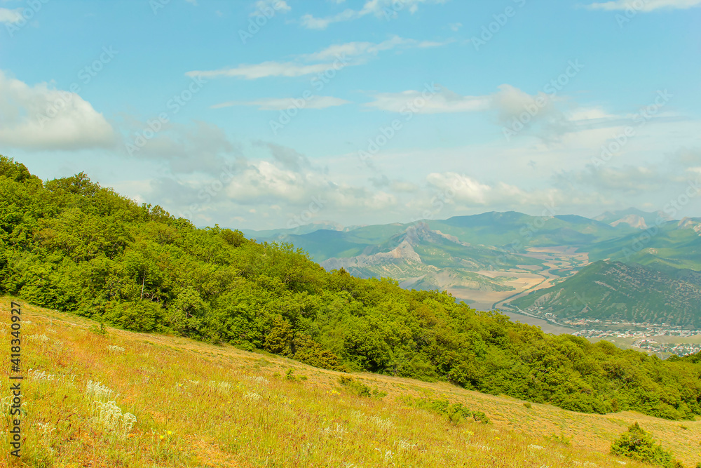 Naklejka premium Panorama of the Crimean mountains overlooking the city of Sudak on a sunny day.