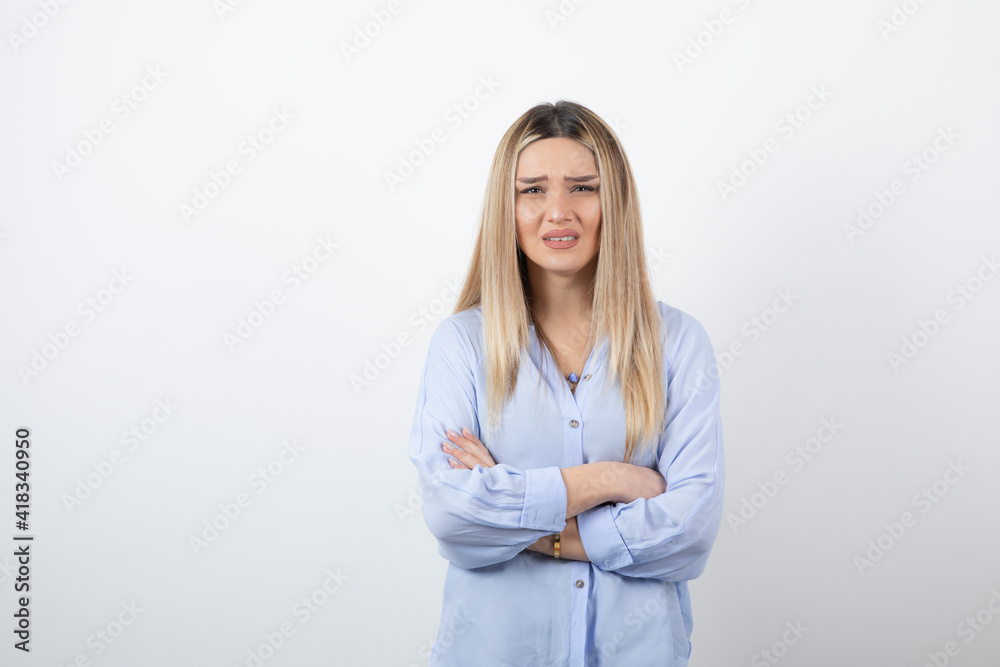 Image of young pretty woman standing on white background Image of young pretty woman standing on white background