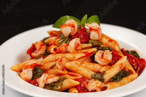 Penne pasta with shrimp and tomatoes