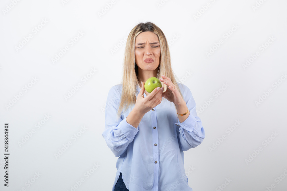 Portrait photo of a pretty attractive woman model standing and holding Portrait photo of a pretty attractive woman model standing and holding