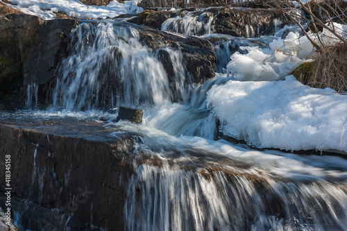 A small waterfall on the river in the spring