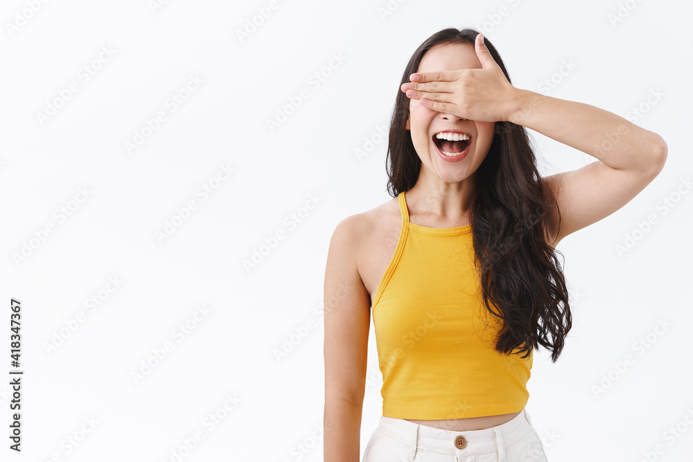 Cheerful happy, carefree east-asian woman cover her eyes with hand and smiling amused, waiting for birthday surprise or taking party halloween contest, not peeking anticipating something interesting Cheerful happy, carefree east-asian woman cover her eyes with hand and smiling amused, waiting for birthday surprise or taking party halloween contest, not peeking anticipating something interesting