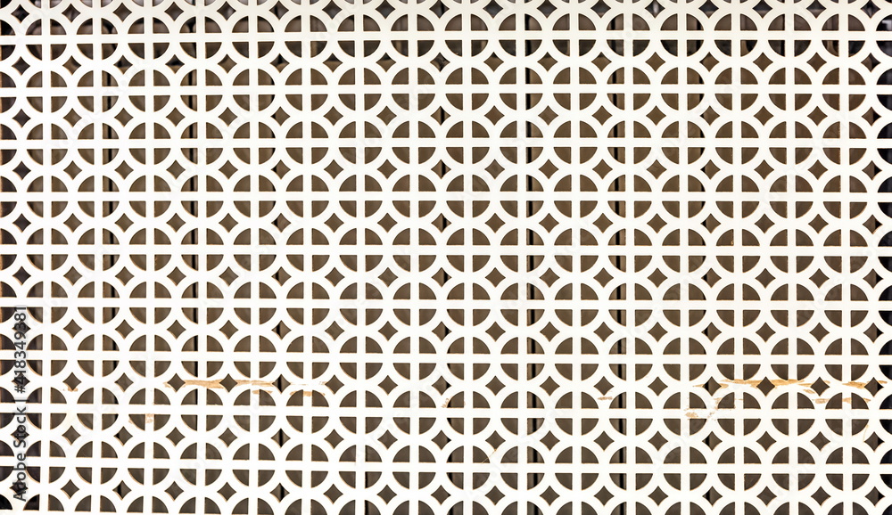 White plastic decorative grille close-up. Background White plastic decorative grille close-up. Background
