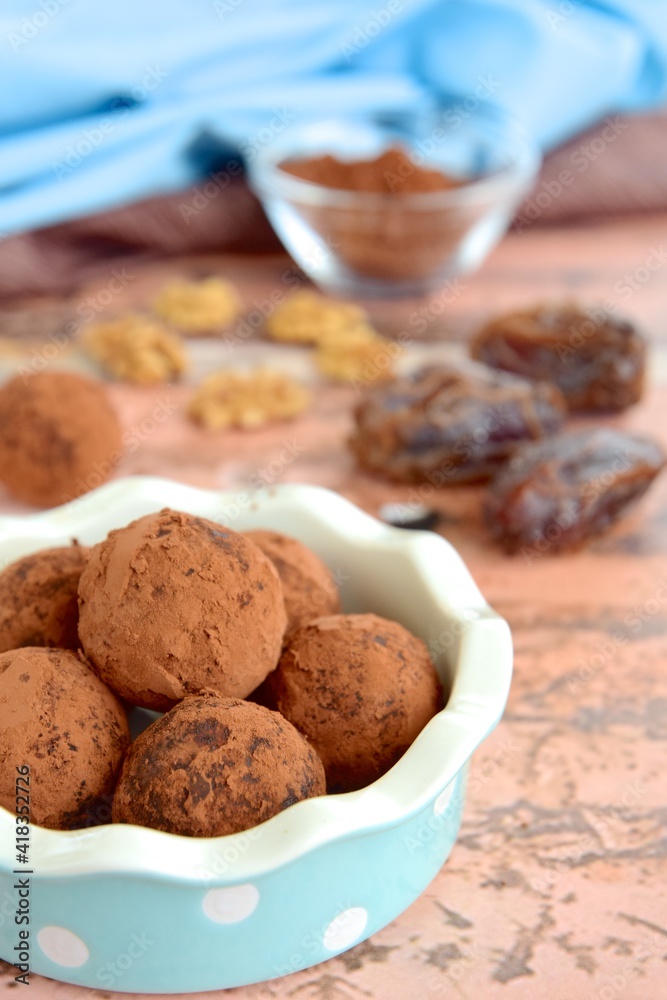 Homemade healthy vegan chocolate truffles with dates and walnuts Homemade healthy vegan chocolate truffles with dates and walnuts
