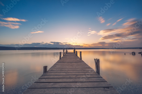 Fototapeta Naklejka Na Ścianę i Meble -  Old wooden dock at the lake, sunset shot