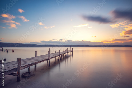 Old wooden dock at the lake, sunset shot © ValentinValkov