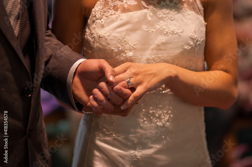 the bride and groom exchange rings. High quality photo