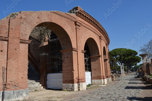 Red brick Arches of ancient amphitheater from outside at the archeological site of Ostia Antica Rome Italy 