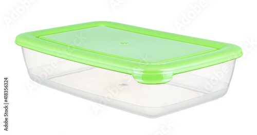 Closed by green lid empty transparent plastic food container isolated on white background