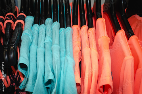 Women's T-shirts on a hanger.