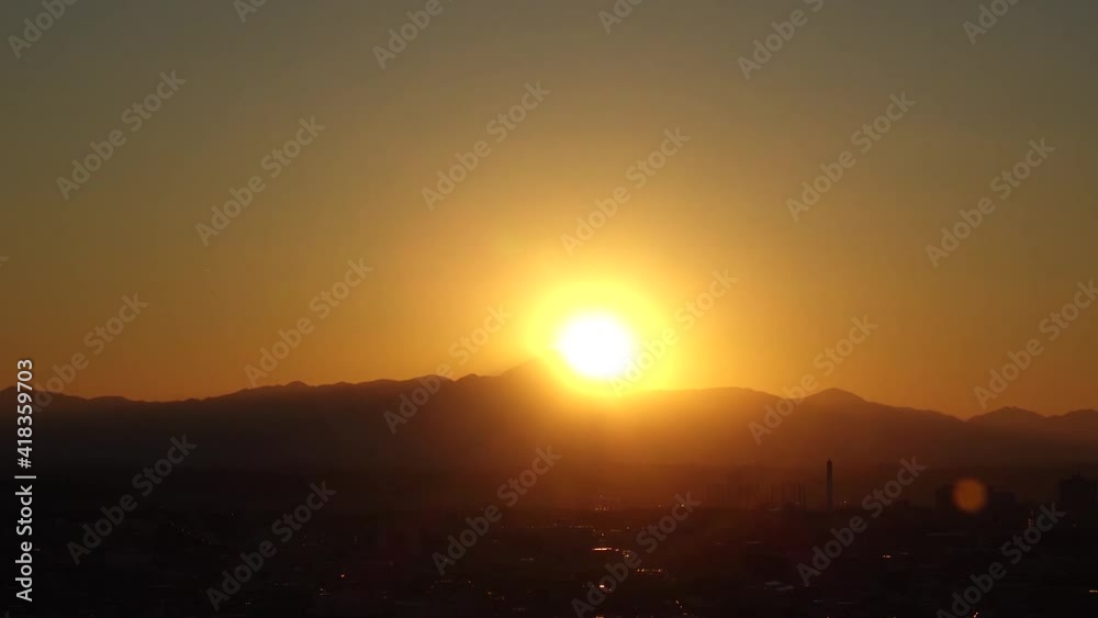 TOKYO, JAPAN : Aerial high angle sunset CITYSCAPE of TOKYO and MOUNT FUJI. View of sinking sun and buildings. Japanese urban city life and metropolis concept. Time lapse zoom out shot dusk to night. TOKYO, JAPAN : Aerial high angle sunset CITYSCAPE of TOKYO and MOUNT FUJI. View of sinking sun and buildings. Japanese urban city life and metropolis concept. Time lapse zoom out shot dusk to night.