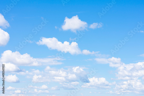 Fototapeta Naklejka Na Ścianę i Meble -  Lots of cumulus clouds far on horizon on blue daylight sky as natural background