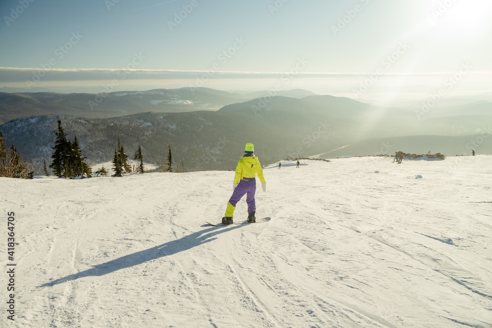ski resort, a girl in a yellow sports uniform on the top of a mountain, sheregesh February 15, 2021