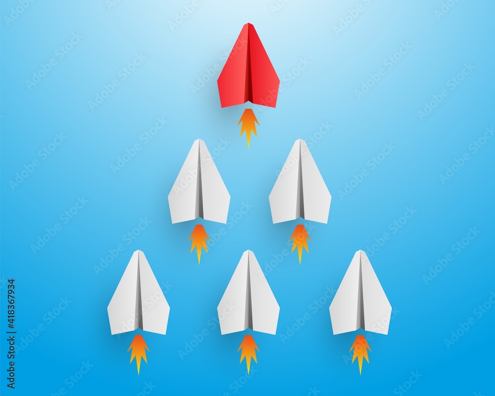 Individual red leader paper plane lead other with fire. Business and leadership concept Individual red leader paper plane lead other with fire. Business and leadership concept
