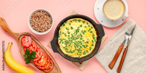 Healthy breakfast - frittata with buckwheat cereal, vegetables and coffee on pink background. Top view