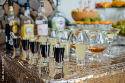 Wedding buffet. Festive buffet. Alcoholic cocktails with different multicolored liqueurs