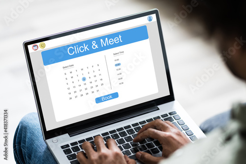 Young Man Using Laptop At Home