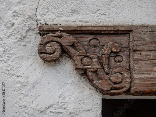 old wooden door frame with sculptured detail