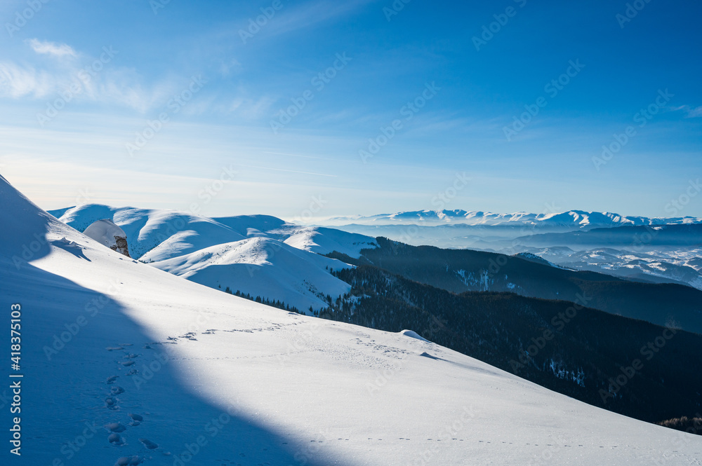 snow covered mountains in Romanian Carpathian mountains during winter