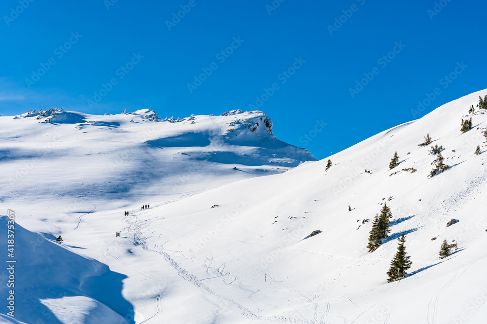 Hikers in the snowy Romanian Carpathians in Winter