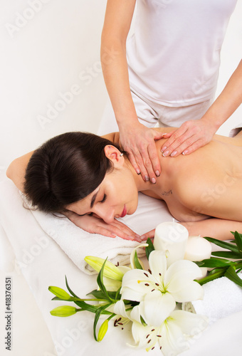Neck massage of a beautiful woman. Massage and spa care