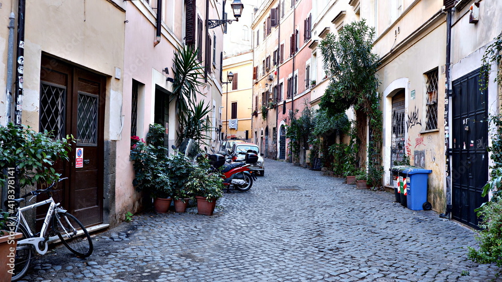 Narrow street of medieval ancient tuff city Pitigliano, travel Italy background