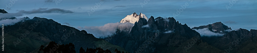 Sahuasiray snowy peak in the Peruvian Andes mountain range with panoramic view during blue hour