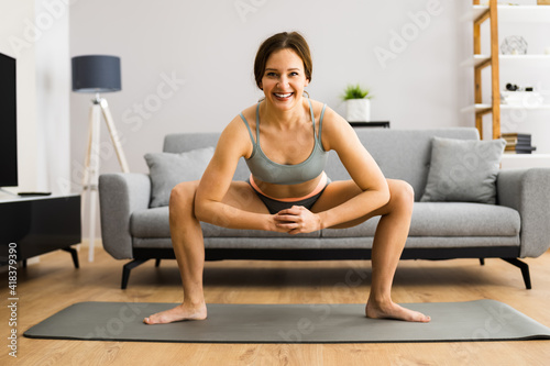 Fitness Woman Doing Leg Stretching Exercise