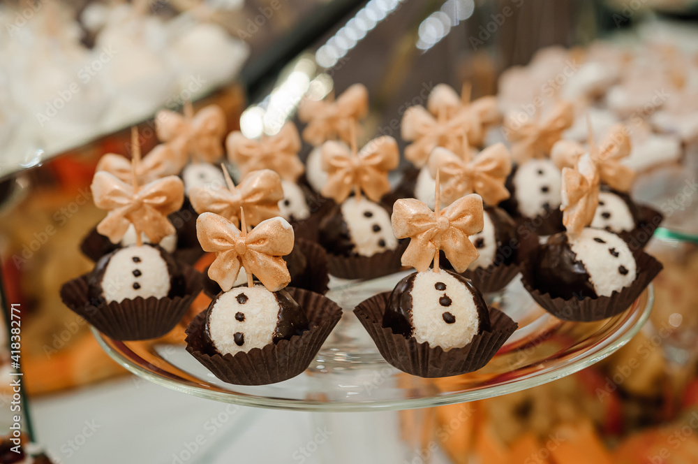 Sweet cakes at a wedding banquet. Catering, sweet festive buffet. Candy bar Sweet cakes at a wedding banquet. Catering, sweet festive buffet. Candy bar