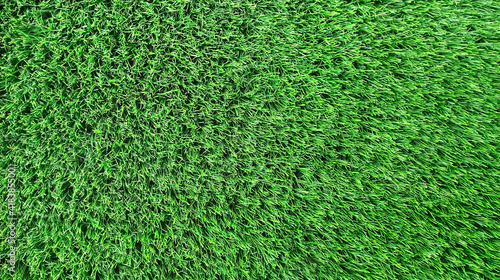 Bright green natural background. Artificial grass close-up.