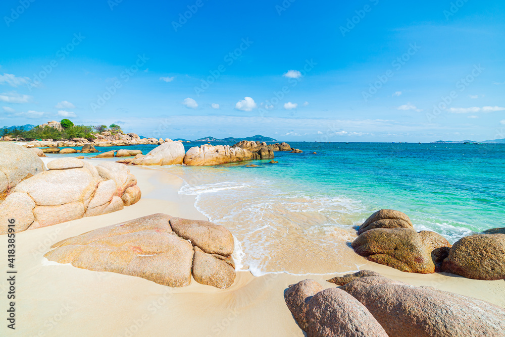 Gorgeous tropical beach turquoise transparent water unique rock boulders, Cam Ranh Nha Trang Vietnam south east coast travel destination, desert beach no people clear blue sky