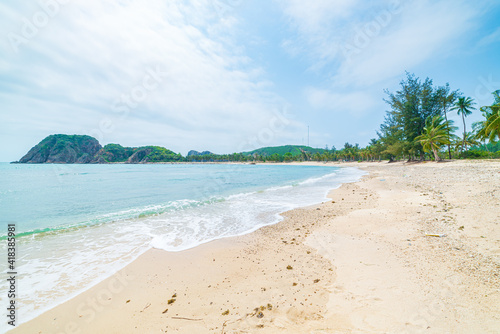 Fototapeta Naklejka Na Ścianę i Meble -  Secluded tropical beach turquoise transparent water palm trees, Bai Om undeveloped bay Quy Nhon Vietnam central coast travel destination, desert white sand beach