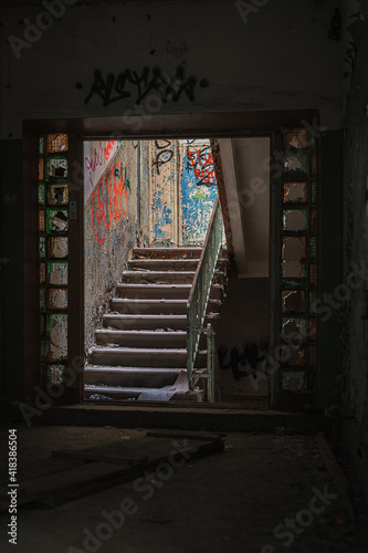 Abandoned Soviet time swimming pool and sports hall complex. Colorful graffiti paintings on the walls. Urban exploration.