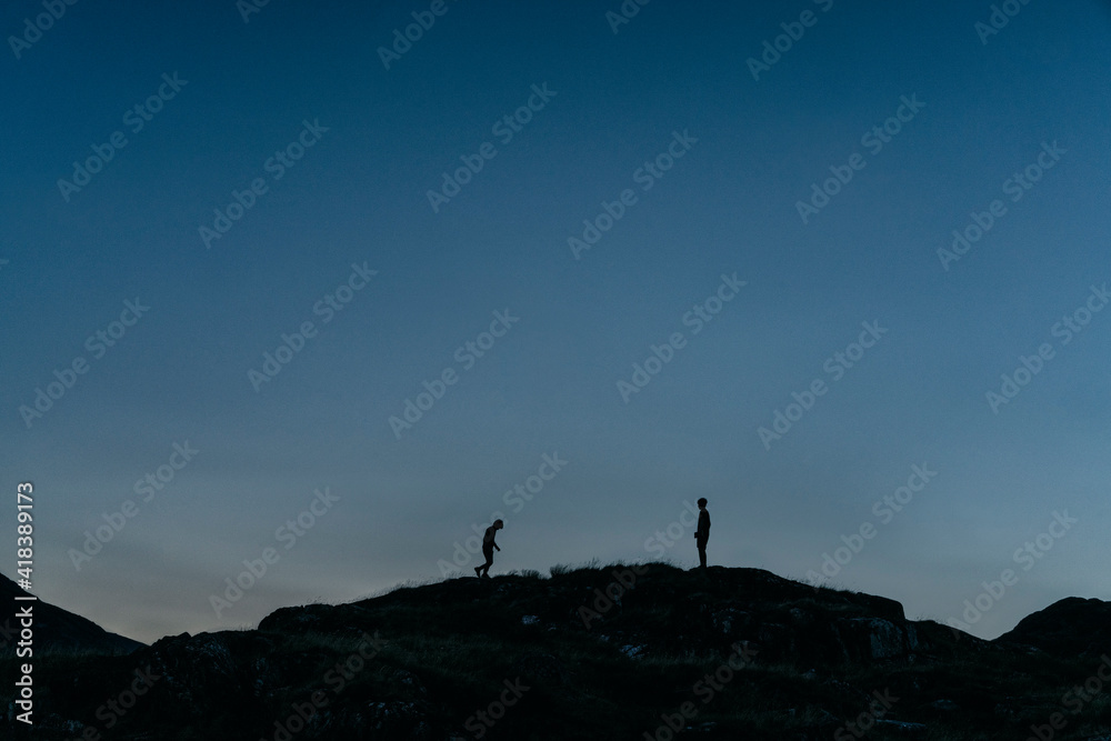 Boys playing on hilltop, Snowdonia, Llanberis, Gwynedd, UK Boys playing on hilltop, Snowdonia, Llanberis, Gwynedd, UK