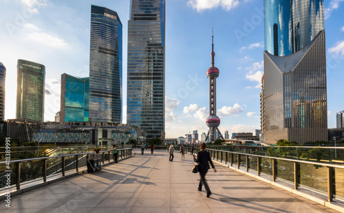 Pudong skyline with Oriental Pearl Tower from elevated walkway, Shanghai, China photo